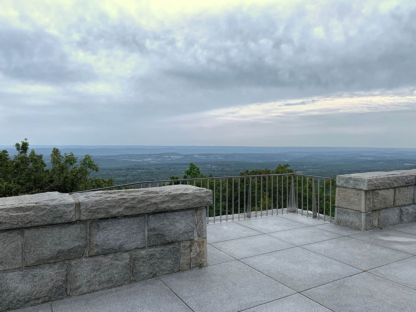 A stone overlook at High Point State Park with a hazy view over the valley
