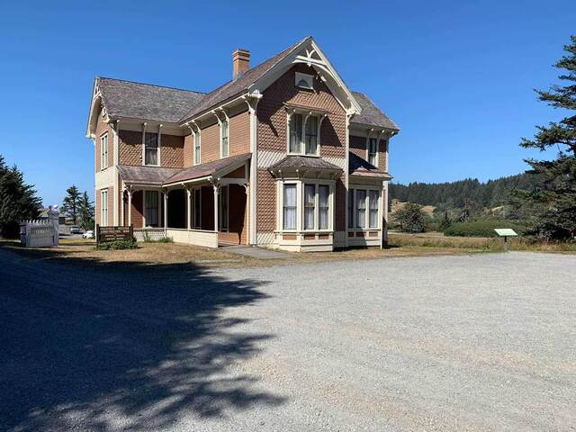 The historic Hughes House, a two-story Victorian farmhouse built in 1898, near Cape Blanco State Park