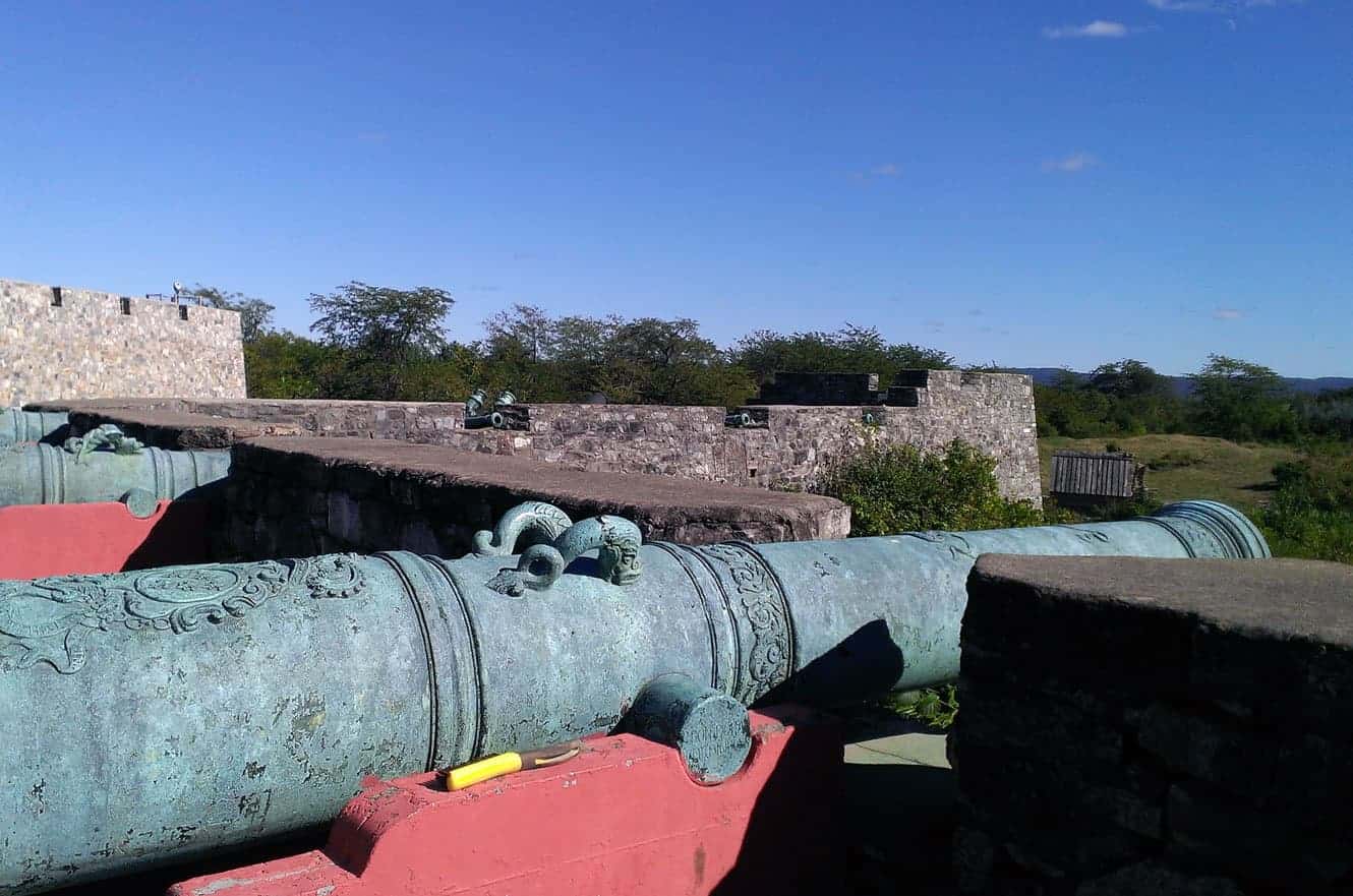 A row of antique bronze cannons along the fort's ramparts overlooking the surrounding countryside