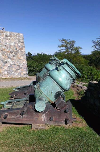 An 18th-century bronze mortar mounted on its carriage on the fort's grounds