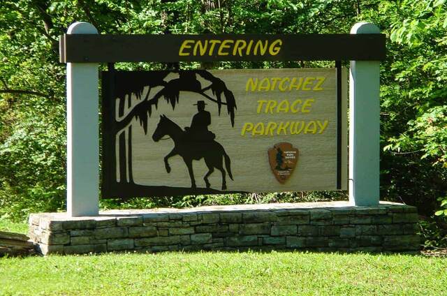 The "Entering Natchez Trace Parkway" sign featuring a silhouette of a horse and rider