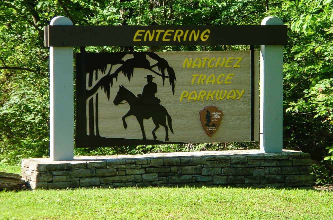 The "Entering Natchez Trace Parkway" sign featuring a silhouette of a horse and rider