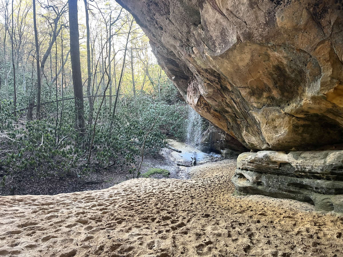 Looking at the waterfall from inside the entrance of the sand cave