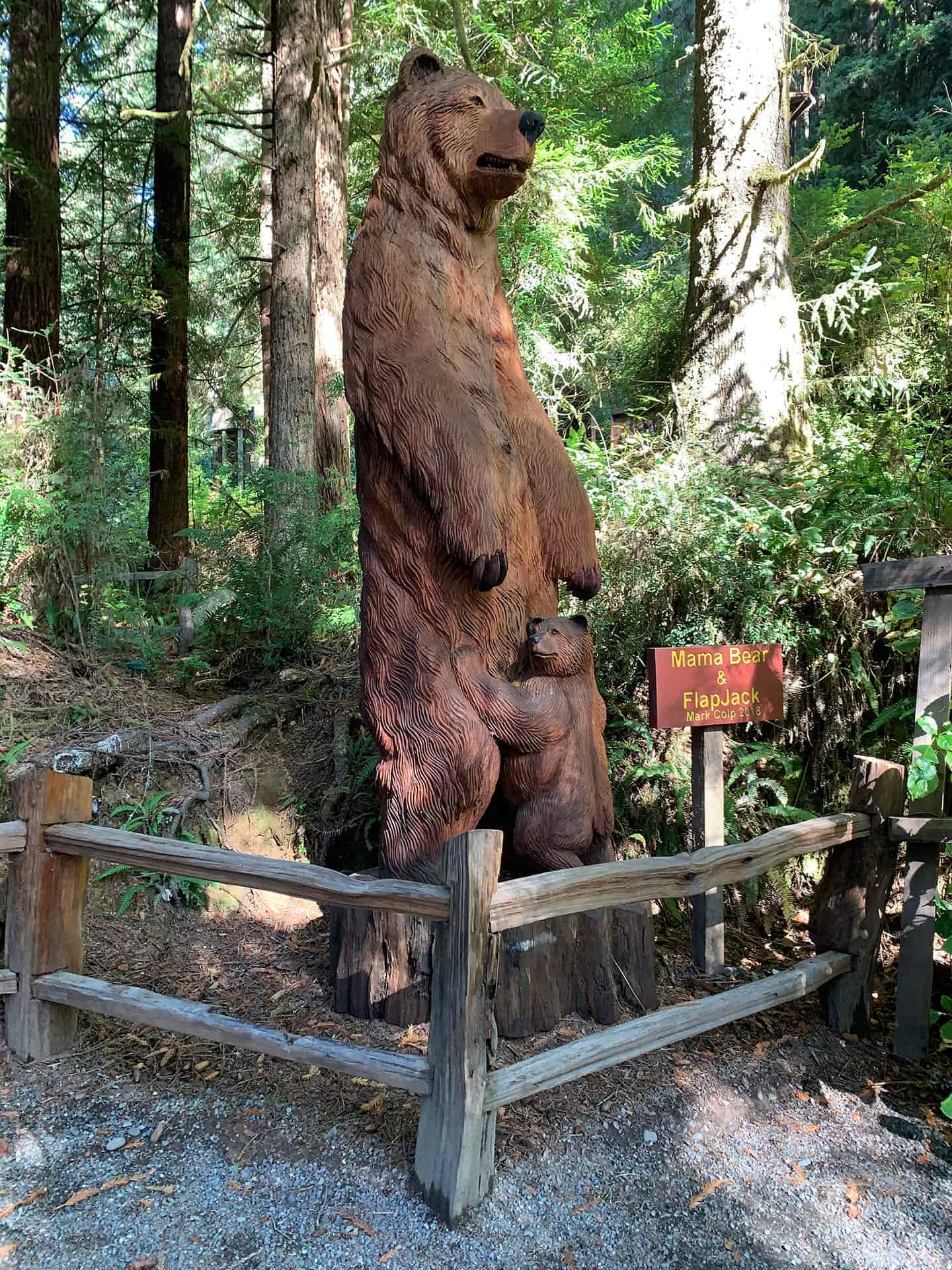 The Mama Bear and FlapJack wood carving along the Trails of Tall Tales