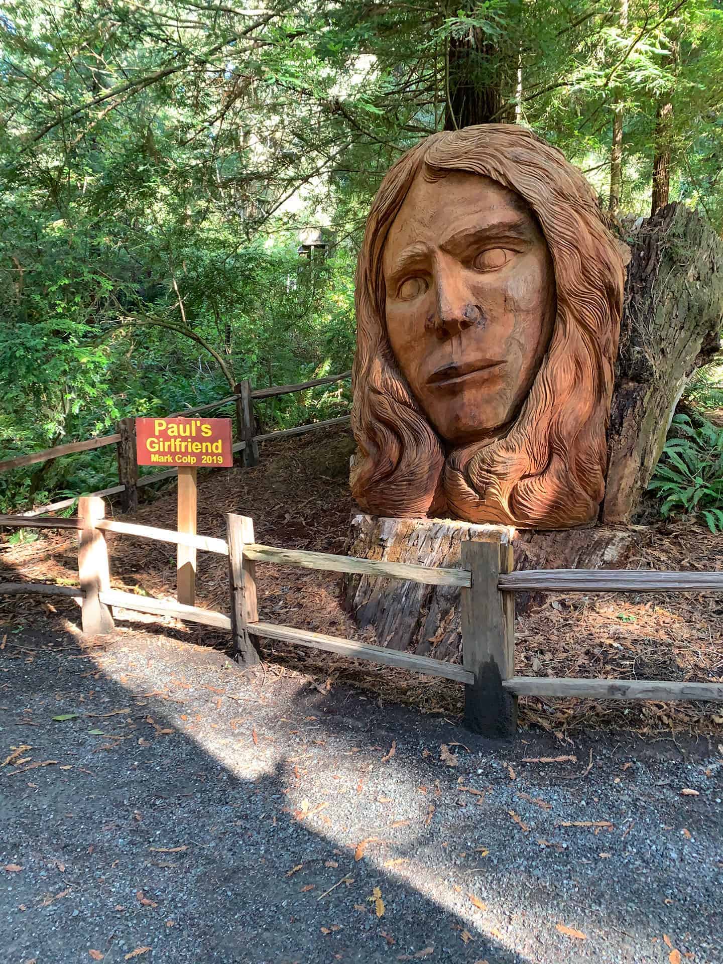 "Paul's Girlfriend," a carved wooden face sculpture along the trail