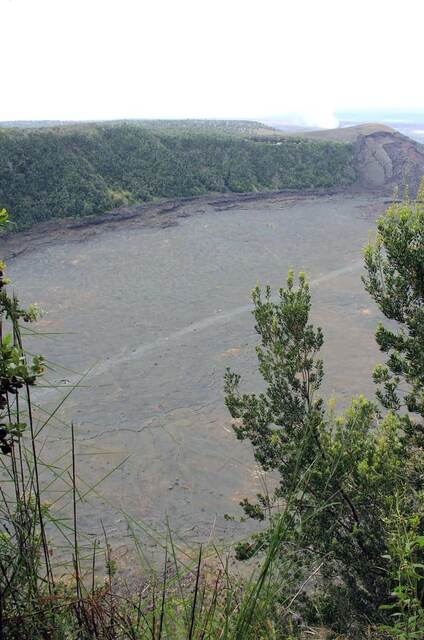 View across the Kilauea Iki crater floor with steam rising near the far rim